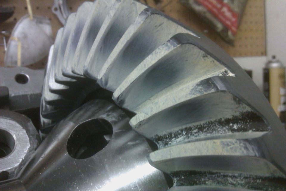 Close-up of a differential ring gear with visible wear marks