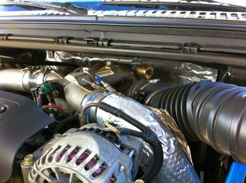 2004 Ford F-250 - Close-up view of the engine bay of a 2004 Ford F-250, showing various components.