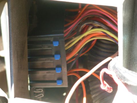 1997 Chevrolet Silverado 3500 - The fuse block is fairly easy to access: pull one 7mm screw, slide the box in & down, and rotate for access to the blue retainer bar (other…