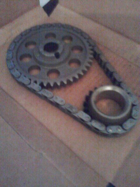 1989 Ford Bronco - A close-up view of a timing chain and sprockets, likely for an engine.