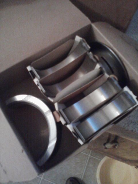 1989 Ford Bronco - New engine bearings are shown inside their original packaging.