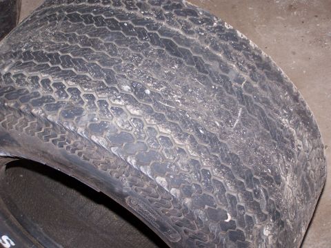 1900 Acura CL - This image shows a close-up of a tire with a worn tread pattern and some debris on its surface.