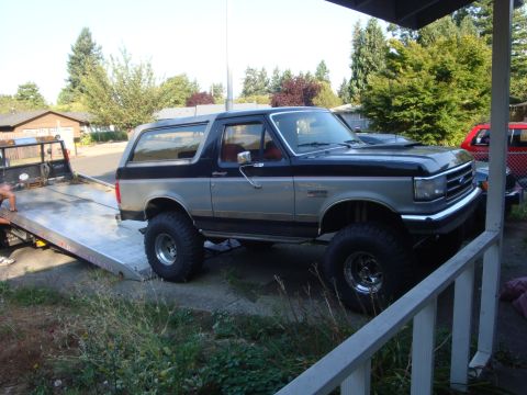 1989 Ford Bronco - This 1989 Ford Bronco is seen in a three-quarter front view, a two-tone silver and black paint scheme.