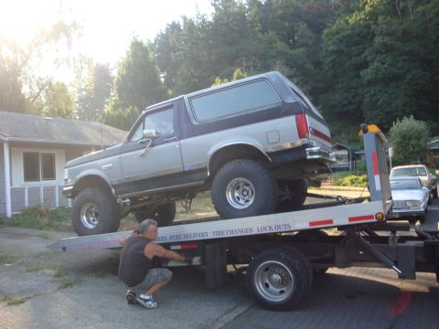 1989 Ford Bronco - 1989 Ford Bronco being transported on a trailer.