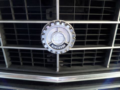 1973 Ford Ranchero - Close-up of a Mercedes-Benz emblem on a vehicle's front grille.