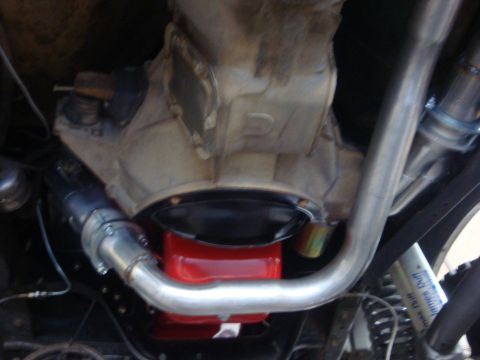 1989 Ford Bronco - Close-up view of the vehicle's drivetrain components, including the transmission and exhaust system.