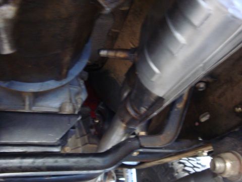1989 Ford Bronco - Underside view of vehicle components including exhaust and transmission.