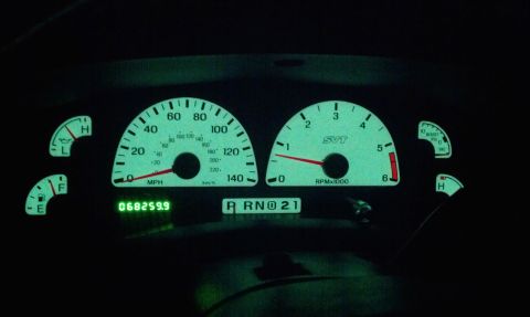 2002 Ford F-150 - The illuminated dashboard of a 2002 Ford F-150 SVT displays speed, RPM, fuel, oil, and boost gauges.