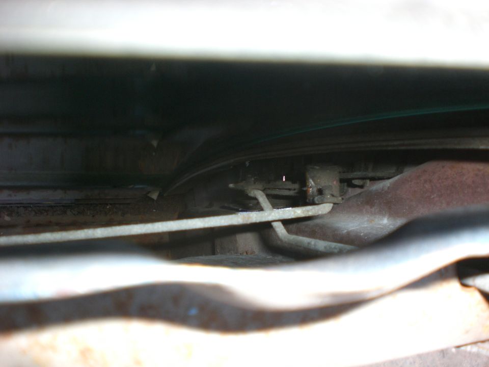 View down inside door. The rod to the left is to the inside release. The onedown and to the right is to the lock knob. This is where the actuator rod will attatch.