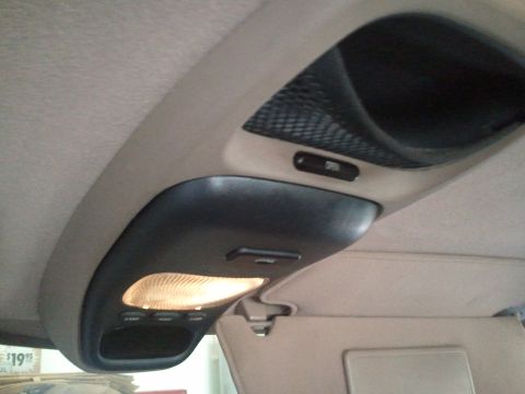 1994 Ford Bronco - Interior overhead console showing lighting, storage, and an 'OPEN' button.
