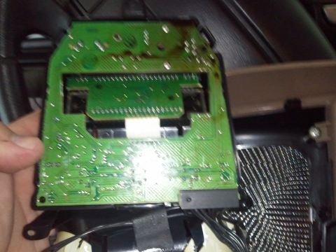 1994 Ford Bronco - Close-up of an overhead console circuit board, showing its internal electronic components and connectors.