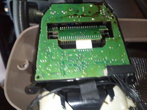 1994 Ford Bronco - Close-up of an electronic circuit board assembly, likely from a vehicle's interior component.