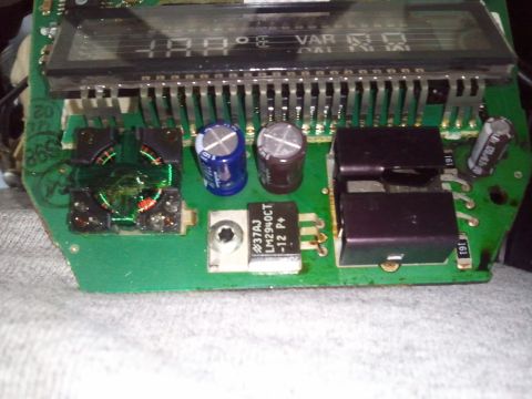 1994 Ford Bronco - Close-up of an electronic circuit board, likely from a vehicle's overhead console, displaying digital information.