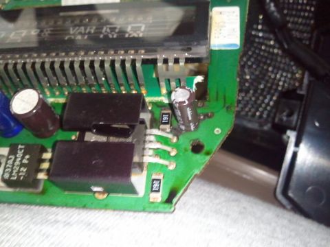 1994 Ford Bronco - Circuit board with electronic components, including a visible LM2940CT chip and capacitors.