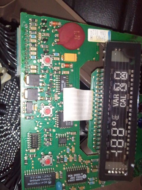 1994 Ford Bronco - A close-up view of an electronic circuit board a digital display and various components.