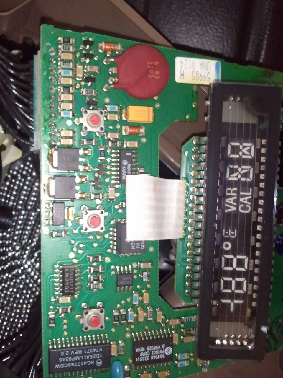 Close-up of a circuit board with a digital display showing '88F' and 'VAR CAL'