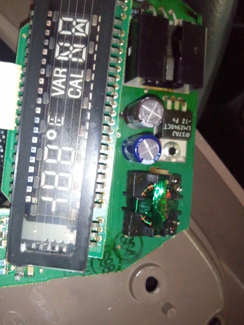 Circuit board with digital display showing '1184' and text 'VAR' and 'CAL'