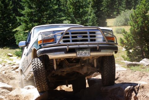 1996 Ford Bronco - This 1996 Ford Bronco navigates a rocky trail, its robust off-road capabilities.