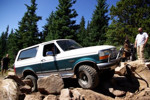 1996 Ford Bronco - 1996 Ford Bronco tackles a challenging rocky terrain during an off-road excursion.