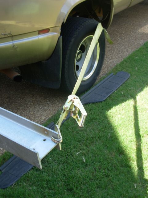 1997 Chevrolet Silverado 3500 - This is how I'm pulling the prybar - the ratchet strap is hooked to the front spring bracket.