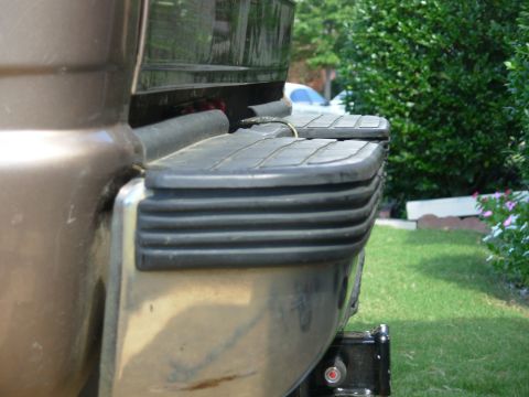 1997 Chevrolet Silverado 3500 - The cover has been warped for so long it makes the bumper look a little worse (from this angle).