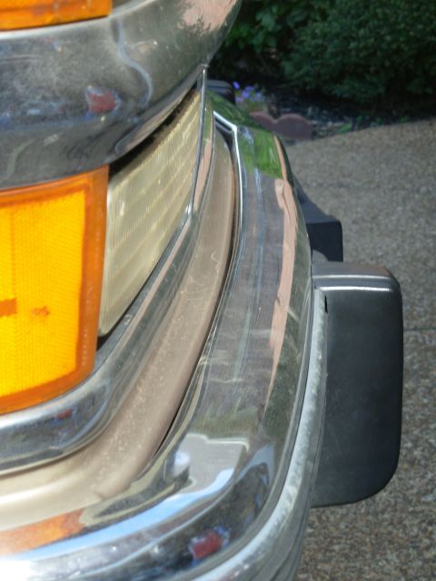 1997 Chevrolet Silverado 3500 - The front is bent the other way, and it's pinning the valance against the oil cooler. Some rust is barely visible just this side of center…