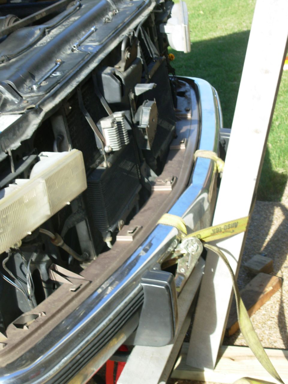 This did much better: a short beam across the towhooks, and the long beam vertical pulling the strap through both nostrils.  I dropped the valance in so I could watch the progress.