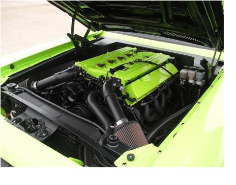 2007 Ford F-250 - Engine bay view of a custom build with bright green engine components and black accents.