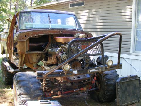 1978 Ford Bronco - This 1978 Ford Bronco has been heavily modified for off-road use, showing its engine and custom bumper.