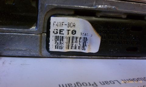 1992 Ford Bronco - Close-up of an electronic control unit with a label containing part numbers and a barcode.
