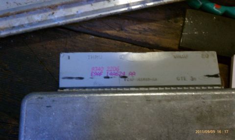 1992 Ford Bronco - Close-up of an engine control module, showing part number E9AF 14A624 AA and other markings.