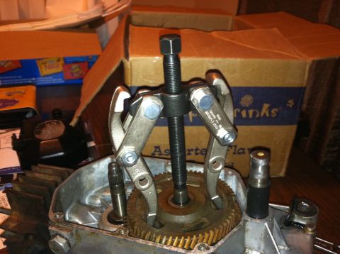 1981 Garelli Rally Sport - A gear puller is being used on a component of an engine, with boxes in the background.