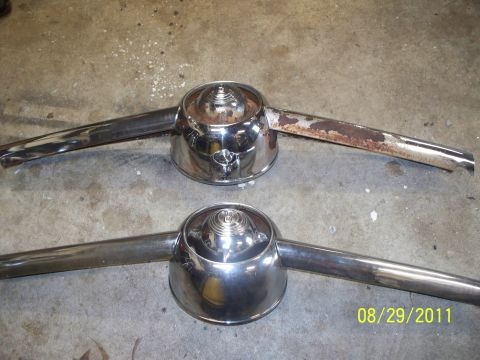 1990 Ford Bronco - Two chrome trim pieces with central domes are shown, one in better condition than the other.