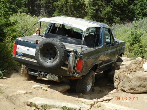 1996 Ford Bronco - This 1996 Ford Bronco navigates a challenging rocky terrain during an off-road excursion.