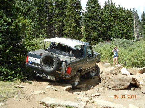 1996 Ford Bronco - Ford Bronco tackling a challenging off-road course in the mountains.