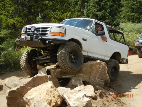 1996 Ford Bronco - This modified 1996 Ford Bronco navigates a rocky obstacle during an off-road excursion.
