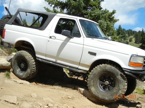 1996 Ford Bronco - This 1996 Ford Bronco navigates a challenging rocky terrain with its soft top off.