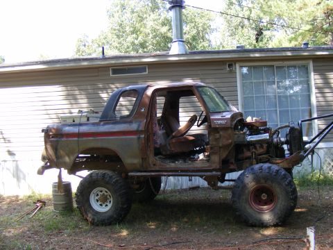 1978 Ford Bronco - This 1978 Ford Bronco is undergoing a project, with its engine removed and large tires installed.