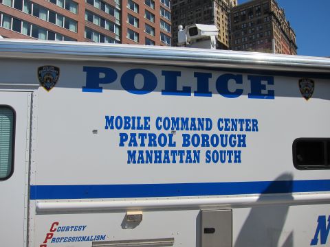 1991 Ford LTD Crown Victoria - white side panel of an NYPD Mobile Command Center vehicle reads POLICE and Patrol Borough Manhattan South with shield emblems.