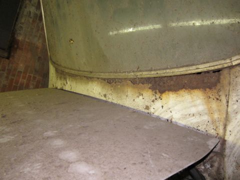 1991 Ford LTD Crown Victoria - Visible rust and dirt accumulation suggest significant wear and tear on this vehicle part.