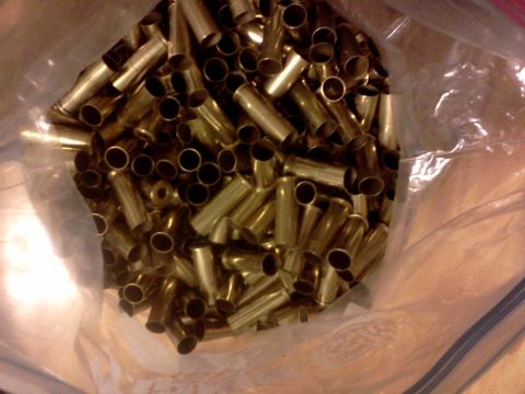 1996 Ford Bronco - A plastic bag is filled with numerous spent brass shell casings.