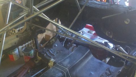 1978 Ford Mustang II - Car chassis with roll cage, suspension parts, and floor pan visible.