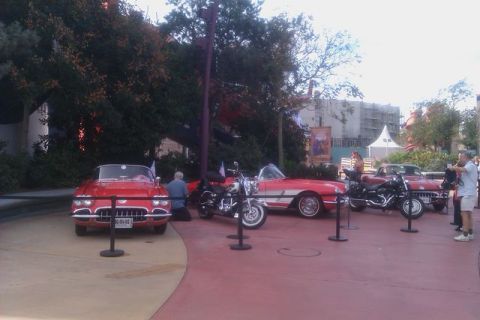 1991 Ford LTD Crown Victoria - Several classic cars and motorcycles are displayed in an outdoor setting.