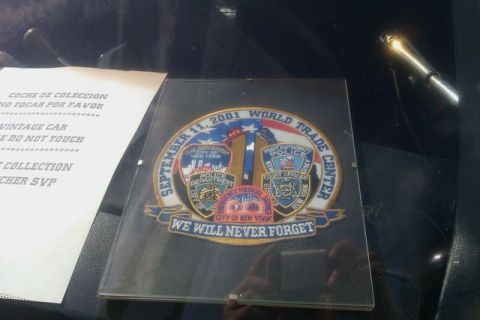 1991 Ford LTD Crown Victoria - A memorial patch commemorating the September 11, 2001 World Trade Center attack is displayed.