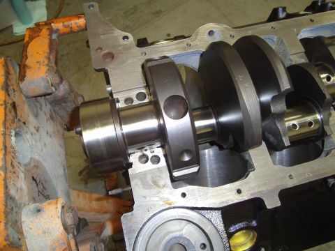 1991 Chevrolet Blazer - Close-up of an engine's crankshaft assembly, with the block partially disassembled.