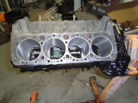 1991 Chevrolet Blazer - An engine block is shown on an engine stand in a workshop environment.