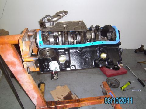 1991 Chevrolet Blazer - Engine block assembly on an engine stand, showing internal components and a blue gasket.