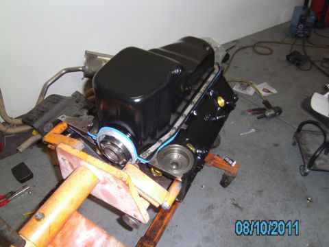 1991 Chevrolet Blazer - An engine block is mounted on an orange stand, ready for assembly or repair in a workshop setting.