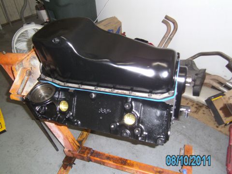 1991 Chevrolet Blazer - Engine block and oil pan assembly on an engine stand, with exhaust components visible behind.