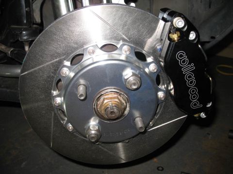 1993 Mazda MX-3 - Close-up of a performance brake system a Willwood caliper and a slotted rotor.